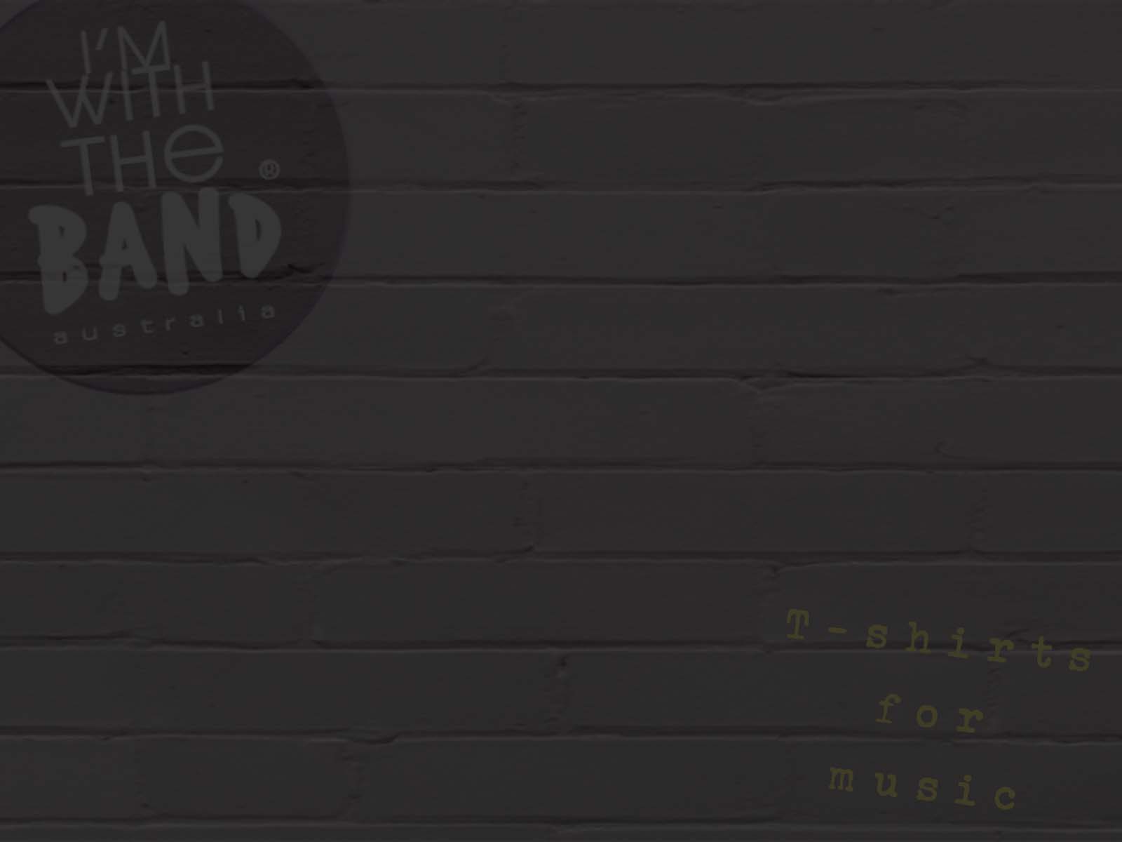 A painted brick wall backdrop for text with the I'm With The Band logo and T-shirts for music written graffiti style on the sides of the brick wall.